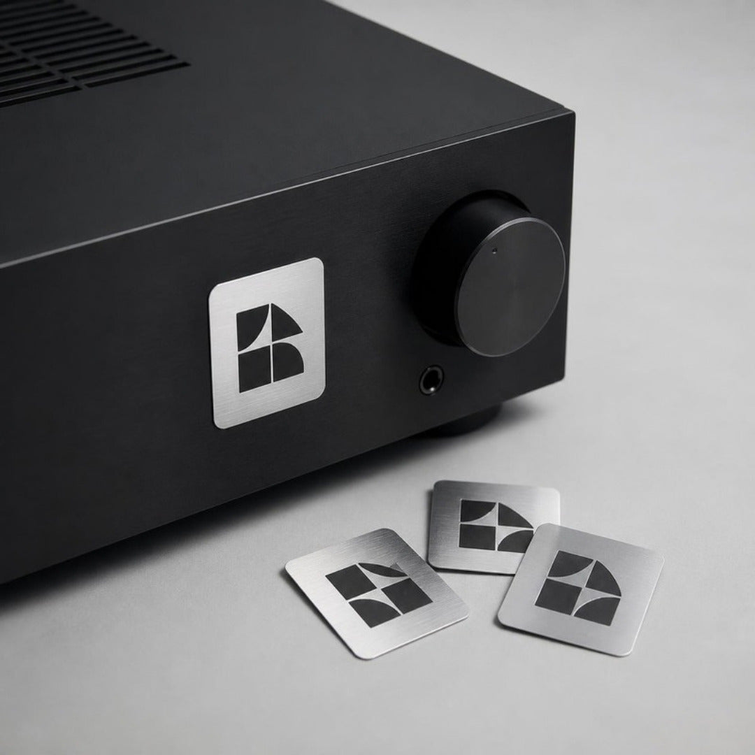 Metallic silver stickers on a black electronic device