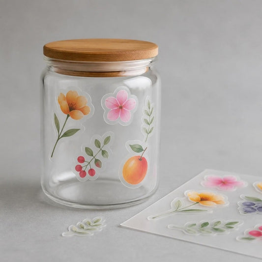 Translucent frosted stickers on a clear glass jar