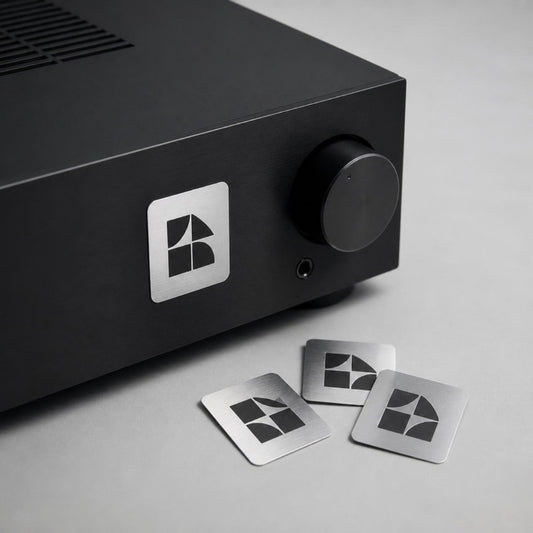 Metallic silver stickers on a black electronic device